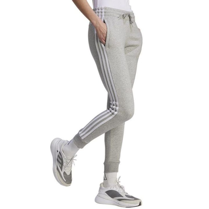 Moteriškos siaurėjančios sportinės kelnės adidas 3 Stripes FL C, pilkos