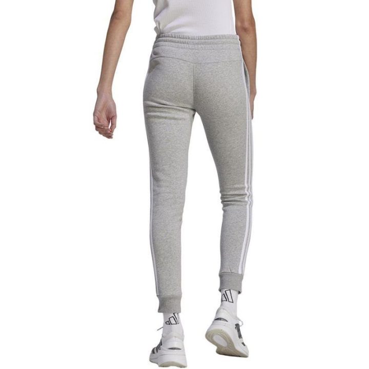 Moteriškos siaurėjančios sportinės kelnės adidas 3 Stripes FL C, pilkos