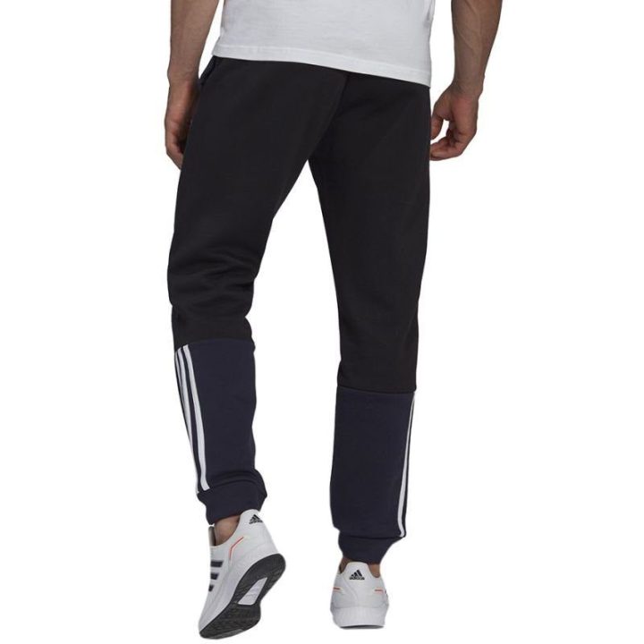 Vyriškos siaurėjančios sportinės kelnės adidas, tamsiai mėlynos
