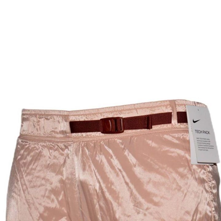 Moteriškos laisvo kirpimo kelnės Nike Tech Pack, rožinio aukso