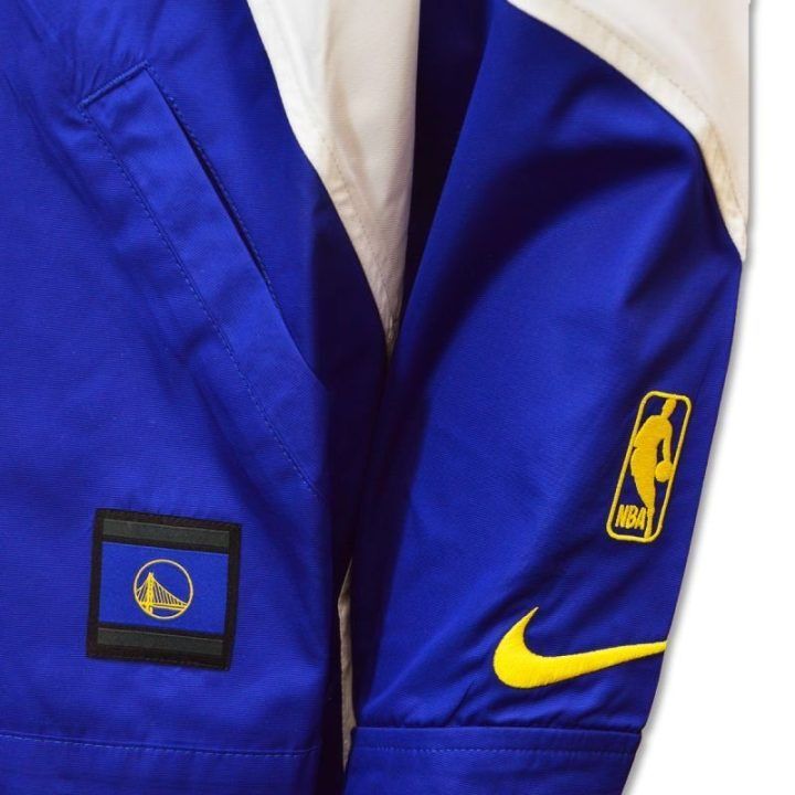 Moteriška vėjo striukė Nike Warriors, geltona, tamsiai mėlyna ir balta